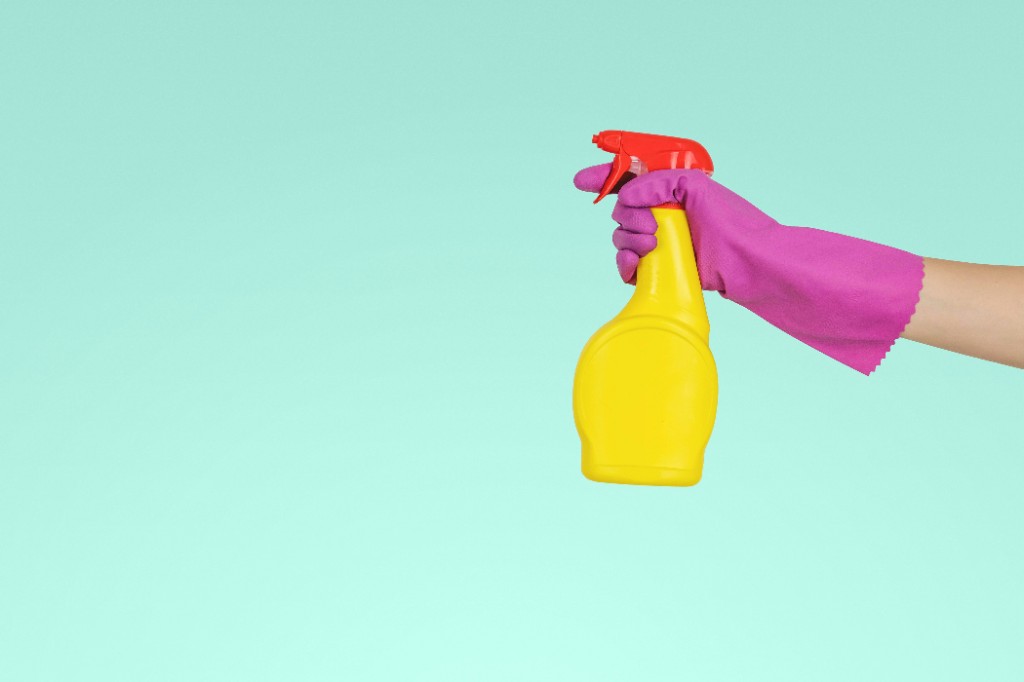 Professional cleaning spray bottle and glove — Thamer Al-Enezi Cleaning Services